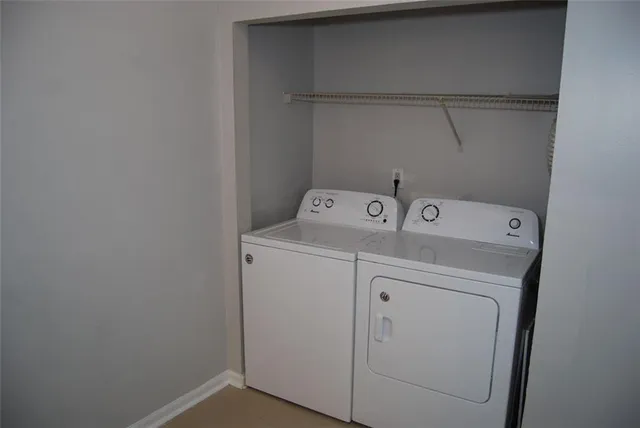 a utility room with dryer and washer