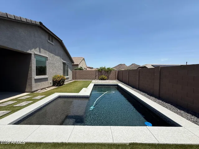 a view of a back yard with an outdoor space