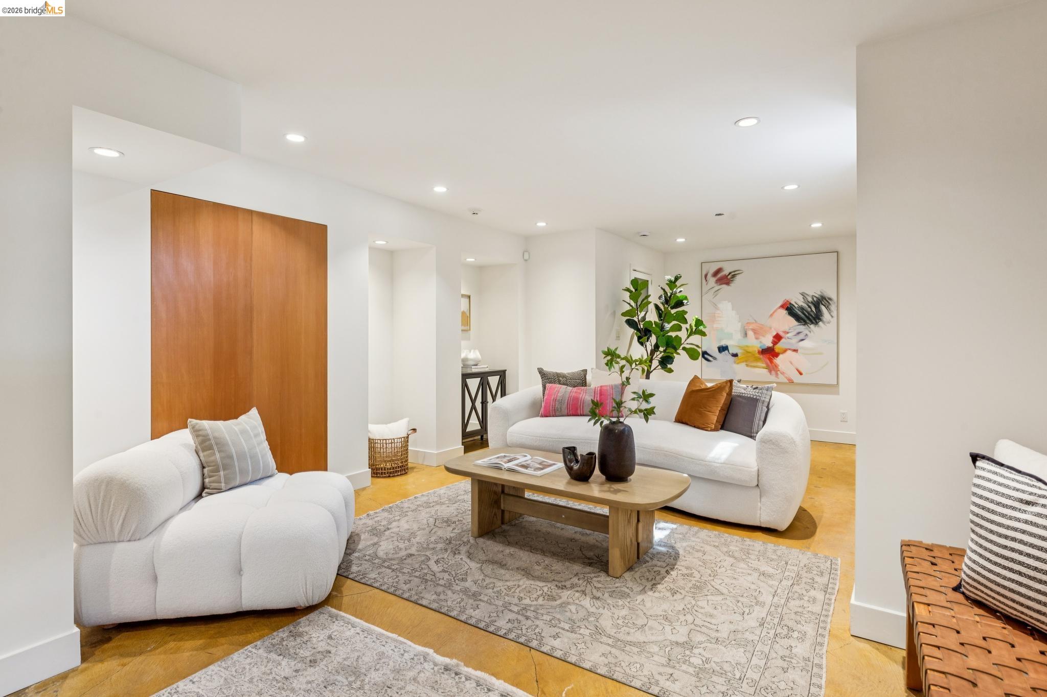1490 Arch Street Berkeley, CA 94708 - Photo 38 of 57 a living room with furniture and wooden floor