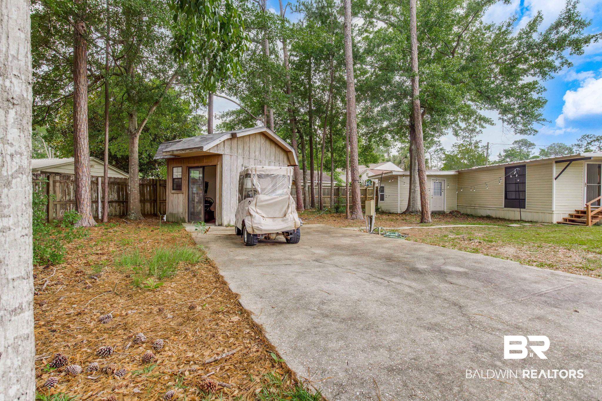 272 Defuniak Circle Lillian, AL 36549 - Photo 1 of 26 View of yard with concrete driveway