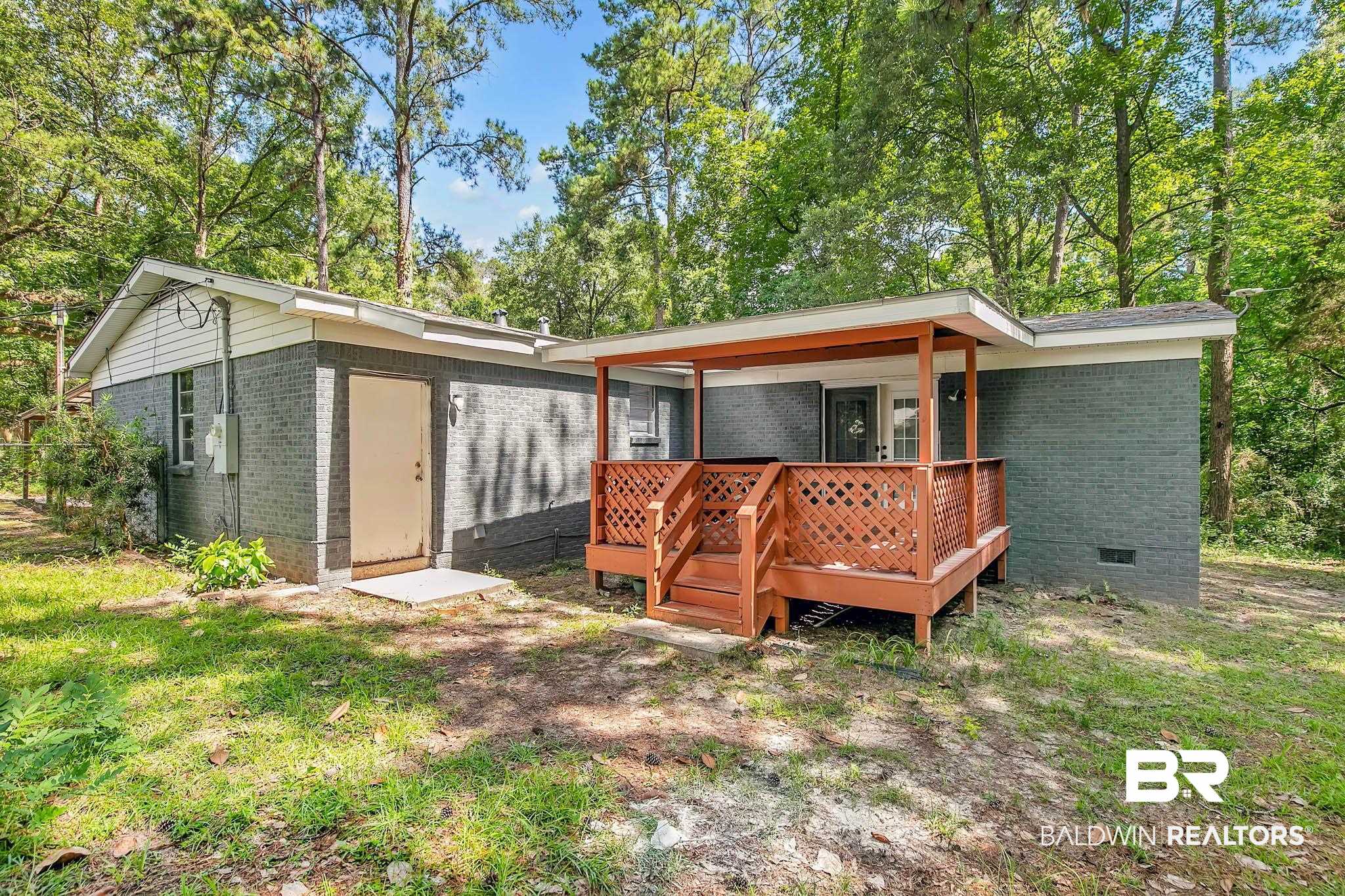 3304 Armond Drive Mobile, AL 36605 - Photo 51 of 62 Back of house featuring brick siding, crawl space, and a deck