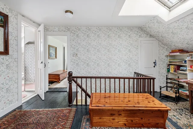 a bedroom with two beds and window