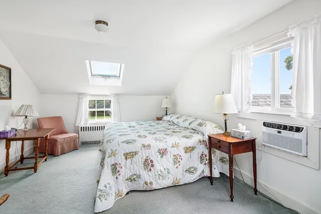 a bath tub sitting in a bathroom next to a window