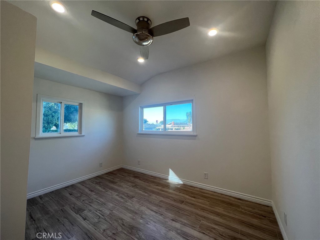 2228 Ridgeview Terrace Corona, CA 92882 - Photo 11 of 12 an empty room with wooden floor and windows