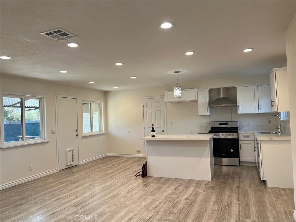 2228 Ridgeview Terrace Corona, CA 92882 - Photo 2 of 12 a kitchen with stainless steel appliances granite countertop a stove a sink and a refrigerator