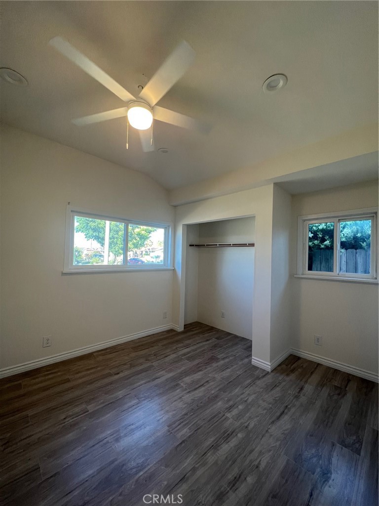 2228 Ridgeview Terrace Corona, CA 92882 - Photo 5 of 12 a view of an empty room with wooden floor and a window
