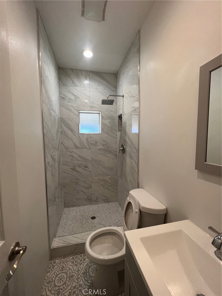 2228 Ridgeview Terrace Corona, CA 92882 - Photo 9 of 12 a bathroom with a sink toilet and shower