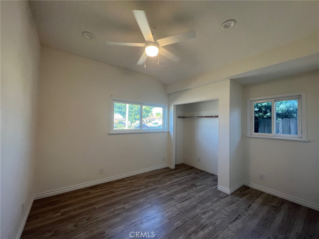 2228 Ridgeview Terrace Corona, CA 92882 - Photo 10 of 12 an empty room with wooden floor and windows