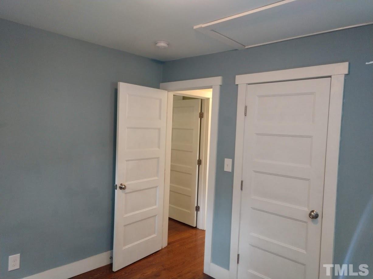 2521 Remington Road Raleigh, NC 27610 - Photo 14 of 30 a view of walk in closet with empty racks