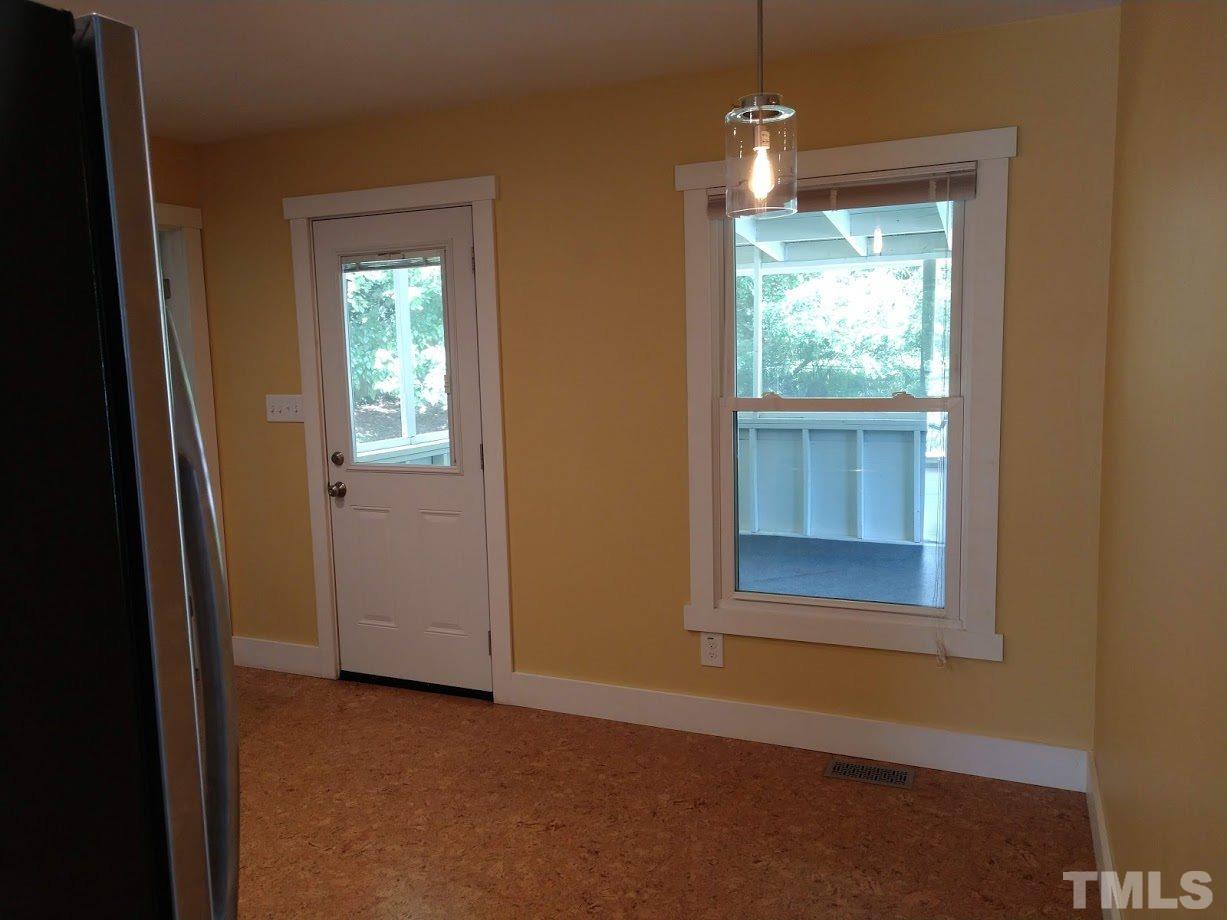 2521 Remington Road Raleigh, NC 27610 - Photo 9 of 30 an empty room that has a window