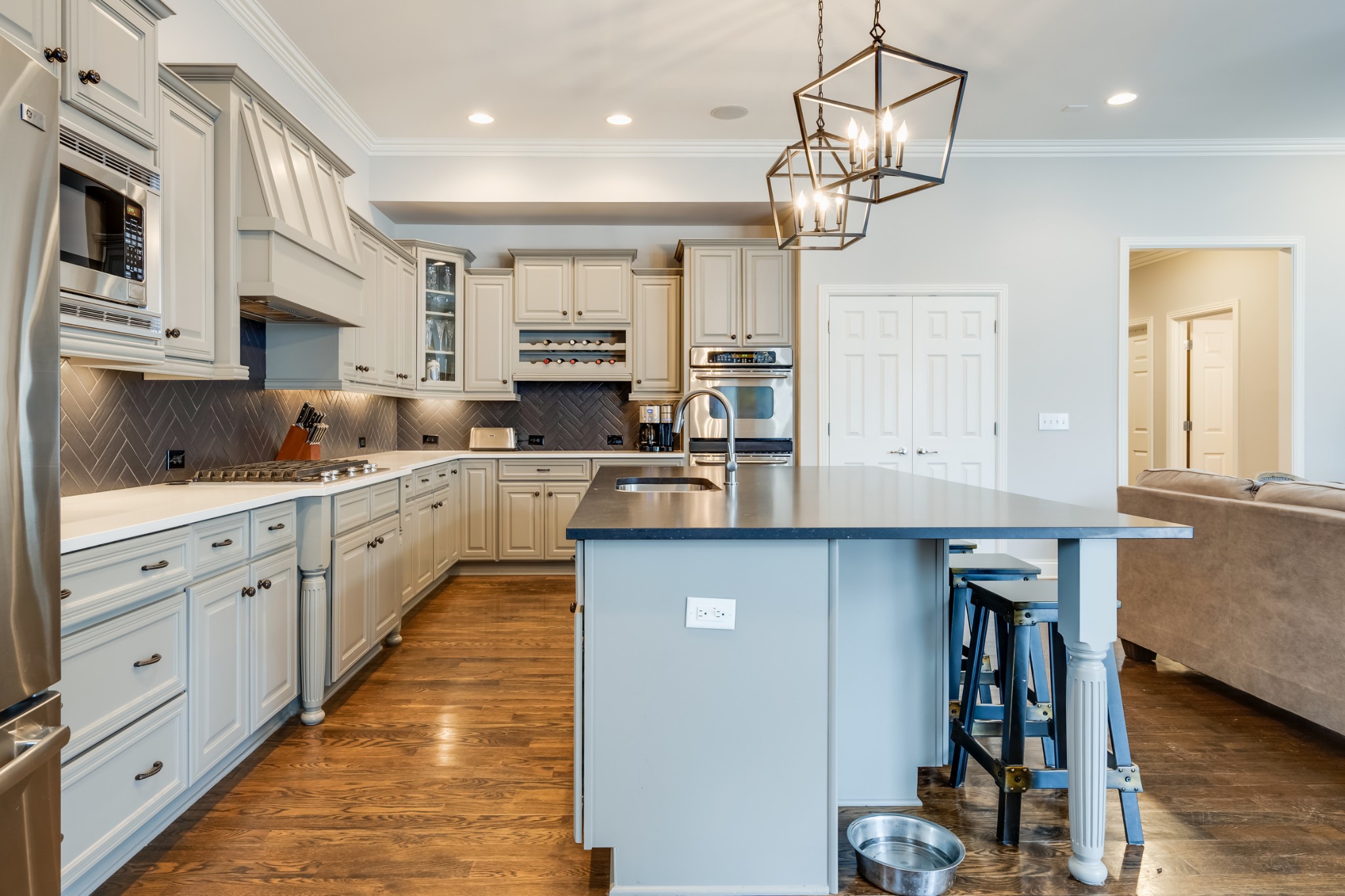 523 Ardmore Place Franklin, TN 37064 - Photo 15 of 24 a kitchen with kitchen island granite countertop a sink cabinets and wooden floor