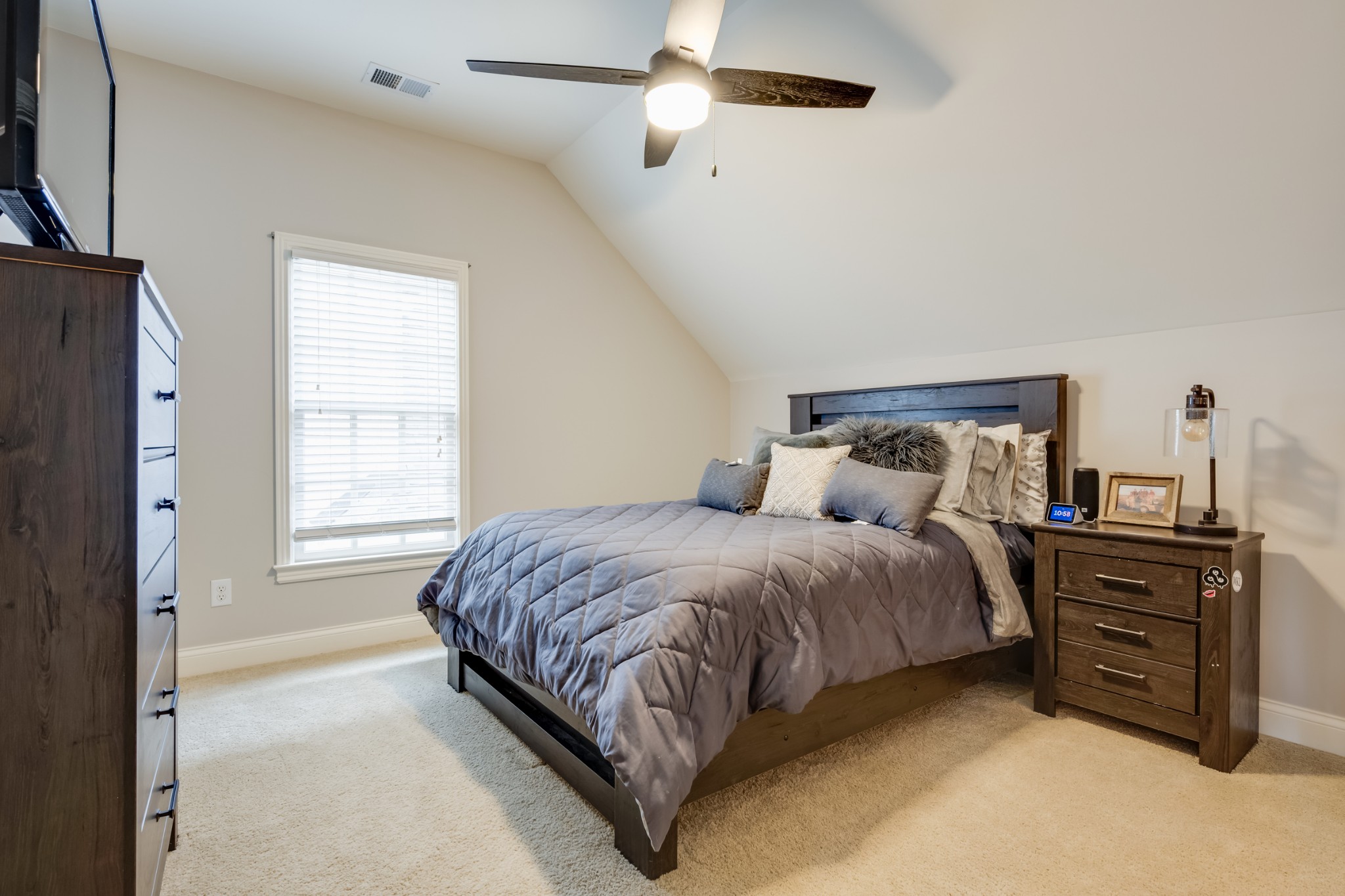 523 Ardmore Place Franklin, TN 37064 - Photo 22 of 24 a spacious bedroom with a bed and dresser