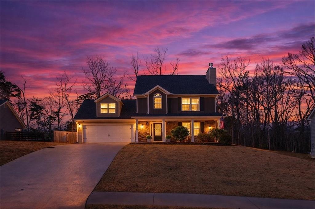 5413 Stepstone Way Gainesville, GA 30506 - Photo 1 of 36 a front view of a house with a yard
