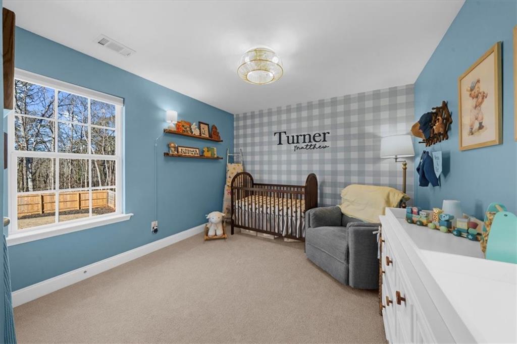 5413 Stepstone Way Gainesville, GA 30506 - Photo 22 of 36 a bedroom with furniture and a window