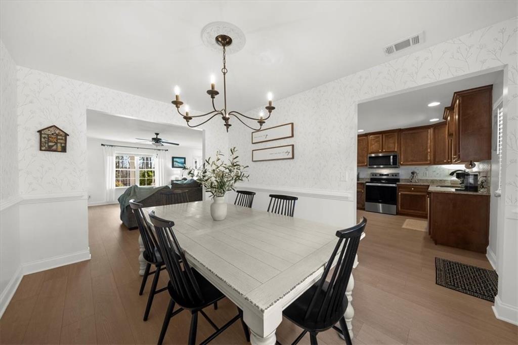 5413 Stepstone Way Gainesville, GA 30506 - Photo 9 of 36 a view of a dining room and livingroom