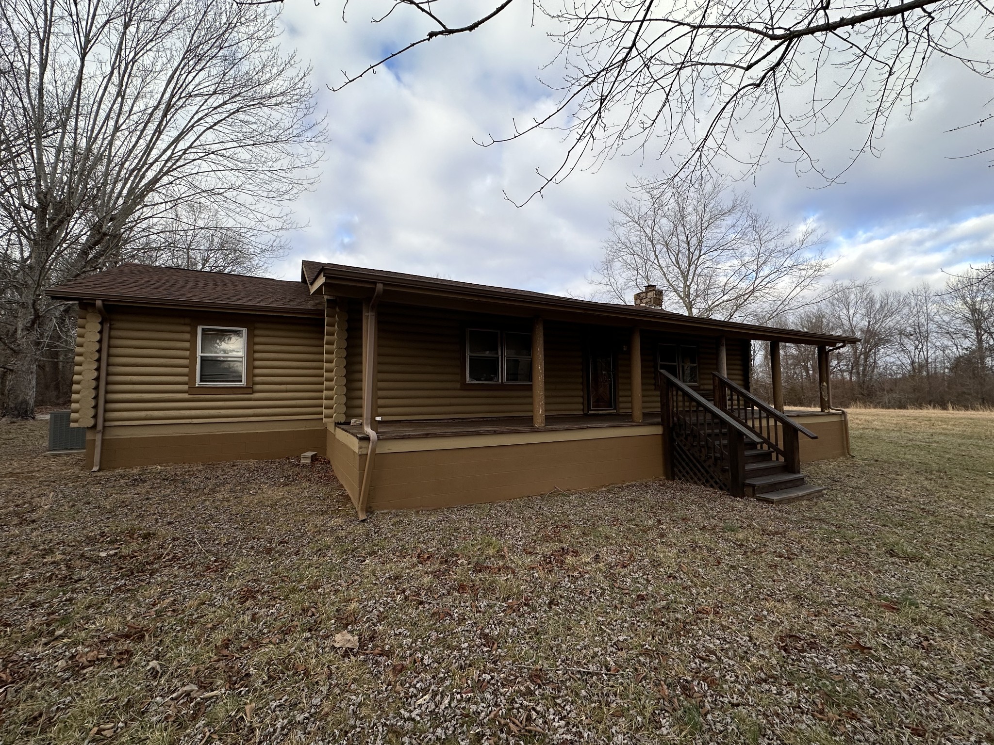 196 Ryans Path Morrison, TN 37357 - Photo 3 of 26 a view of a house with a yard tree and wooden fence