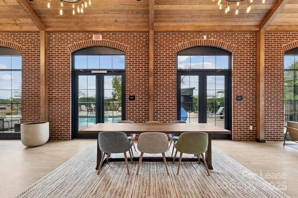 a view of a dining room with furniture and window