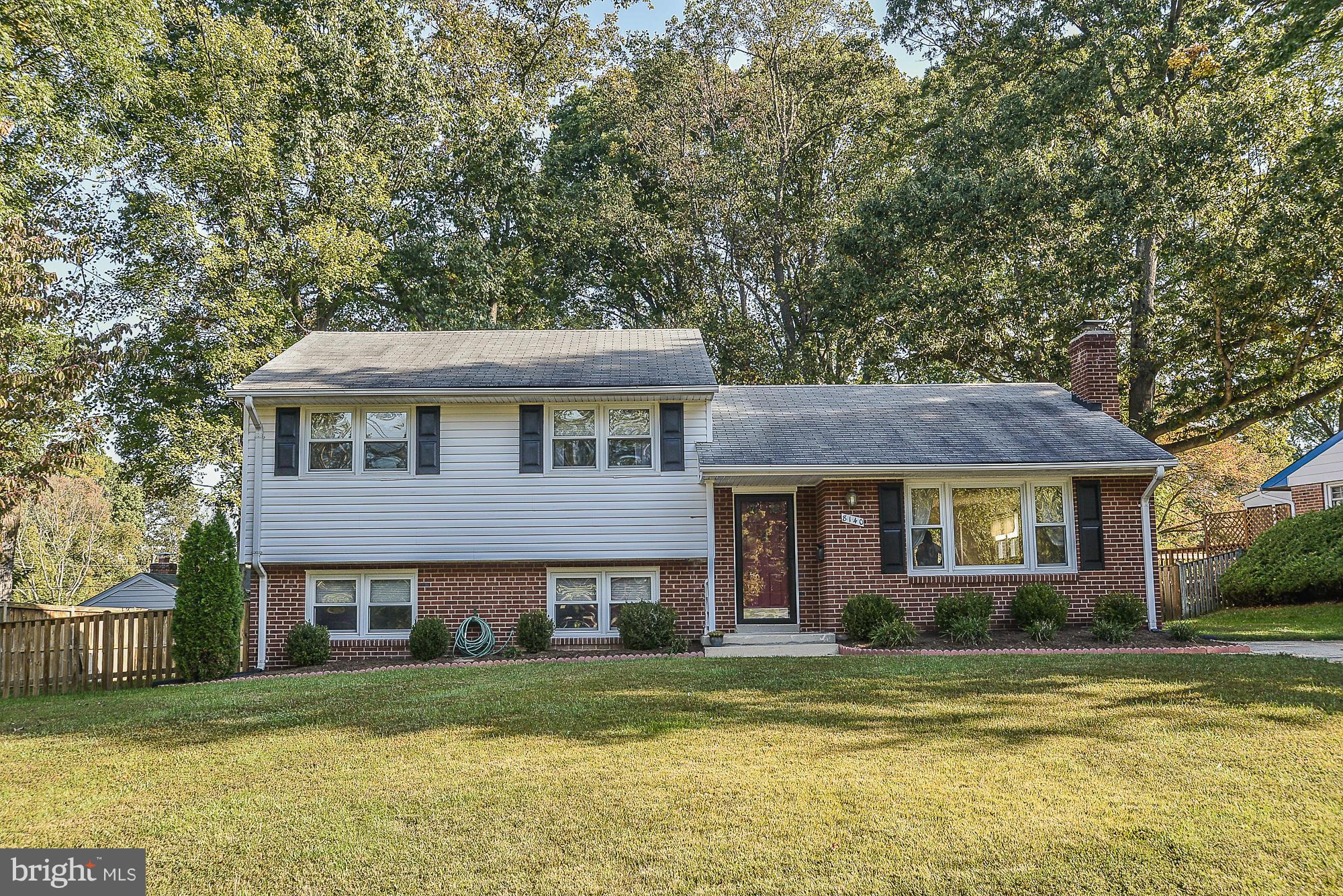 8140 Drayton Lane Springfield, VA 22151 - Photo 1 of 30 a front view of a house with a garden