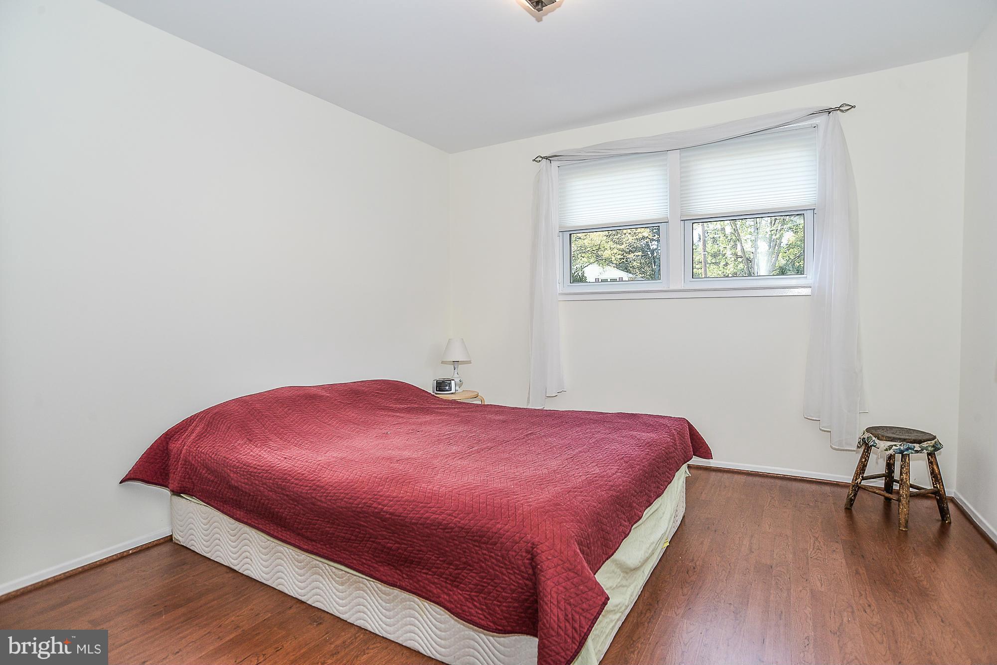 8140 Drayton Lane Springfield, VA 22151 - Photo 16 of 30 a bedroom with a bed and a table