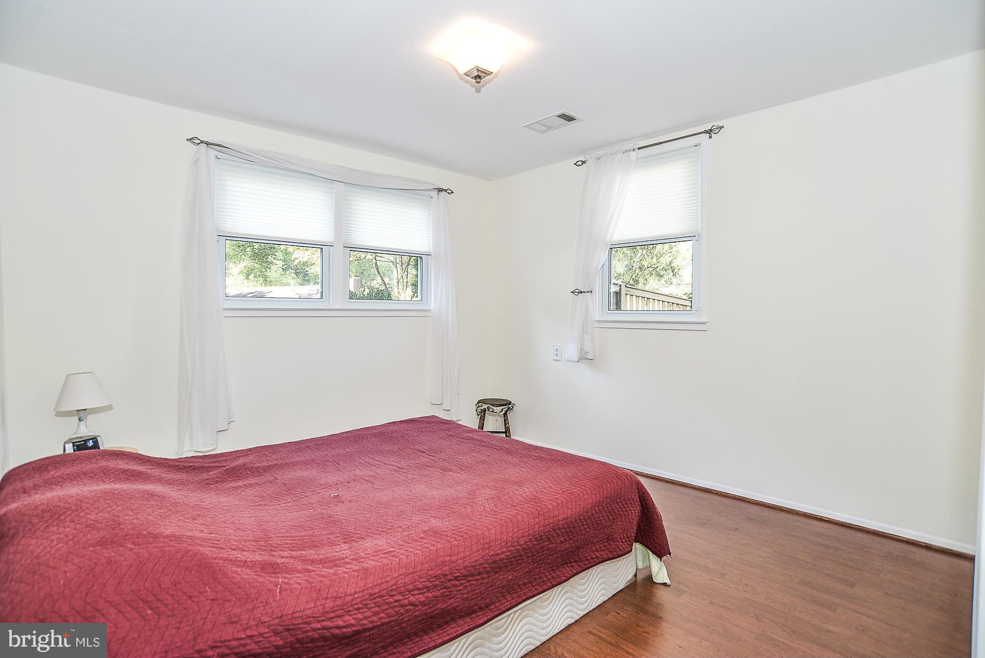 8140 Drayton Lane Springfield, VA 22151 - Photo 17 of 30 a bedroom with a bed and a window