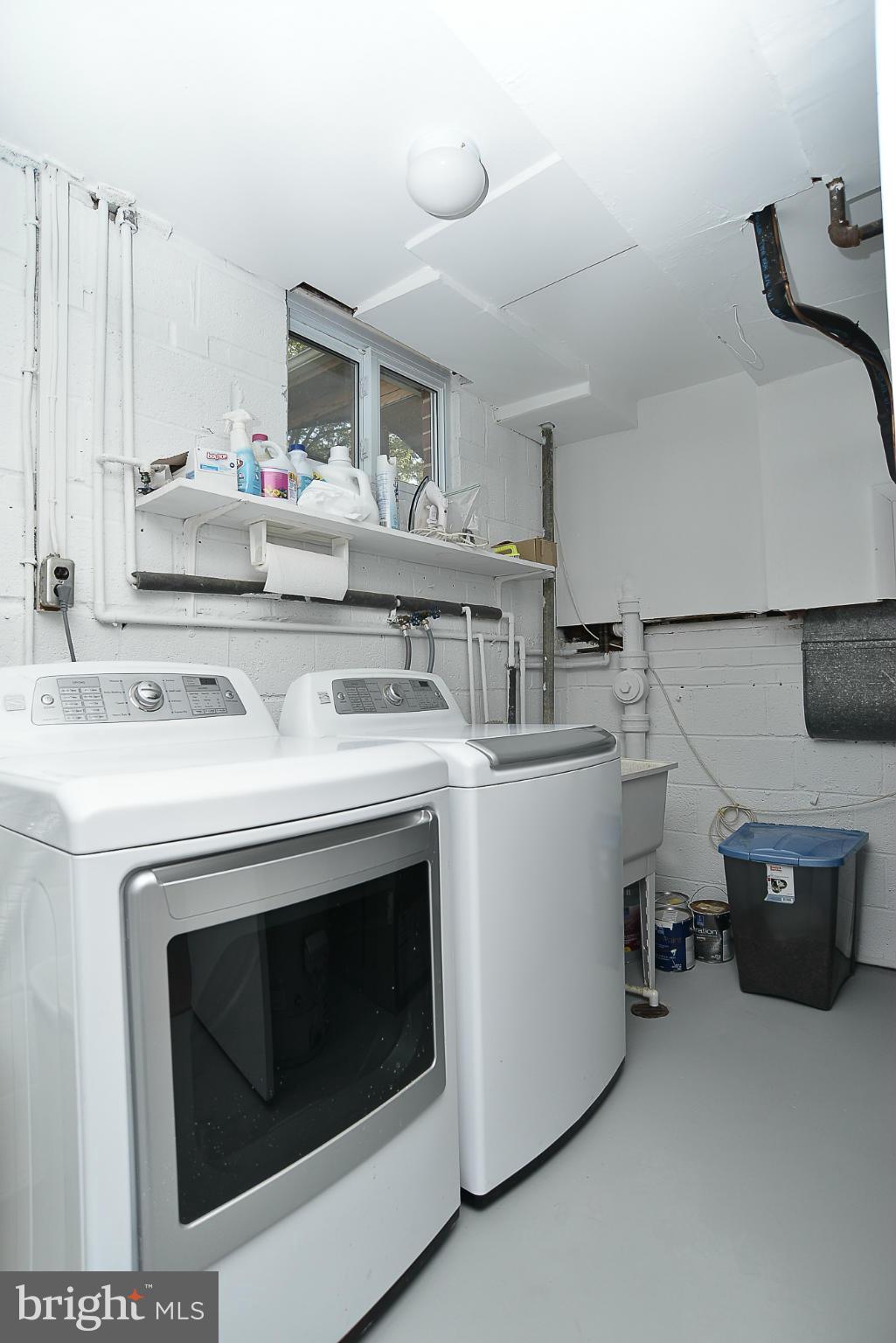 8140 Drayton Lane Springfield, VA 22151 - Photo 20 of 30 a kitchen with a stove and white cabinets