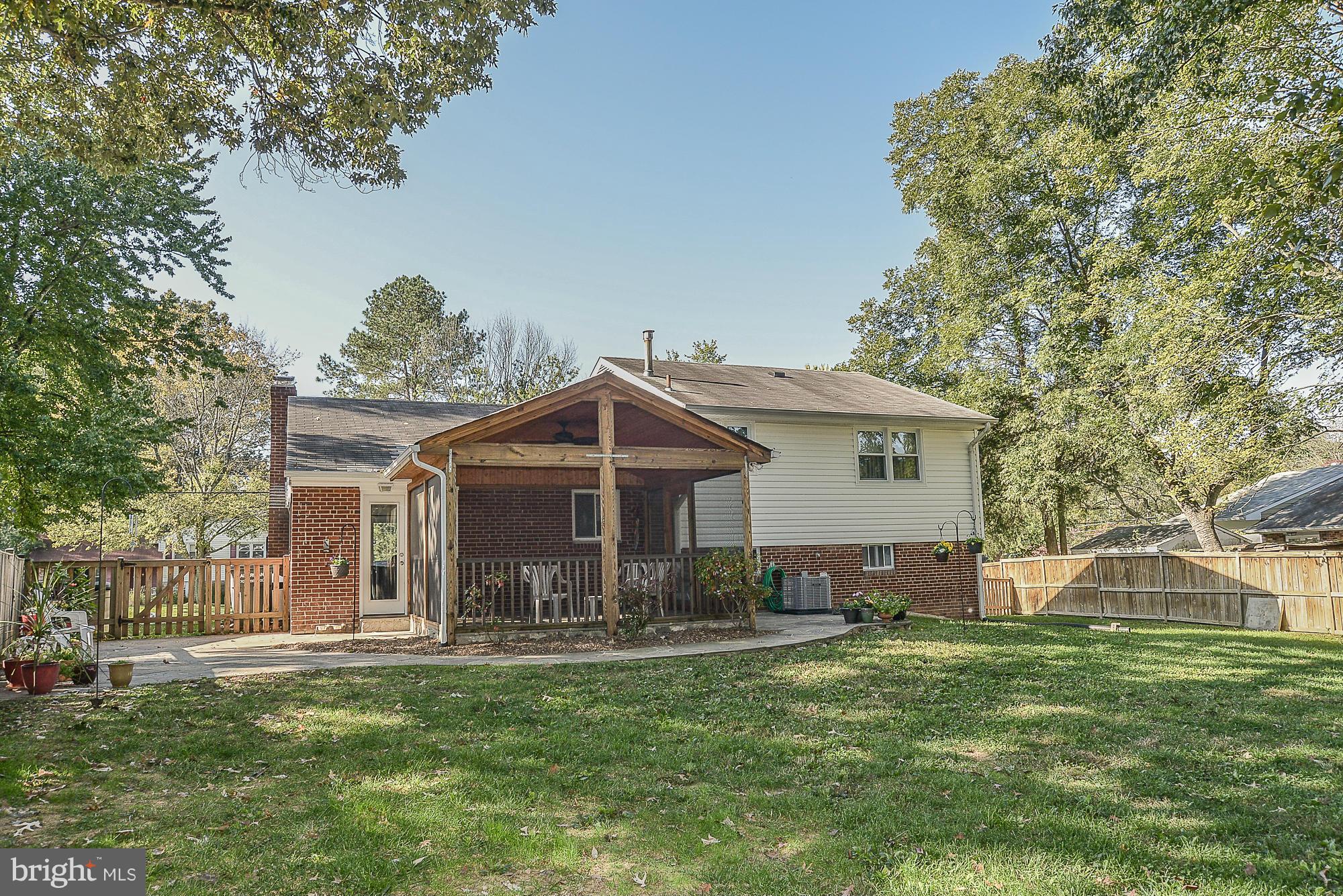 8140 Drayton Lane Springfield, VA 22151 - Photo 25 of 30 a front view of a house with a garden