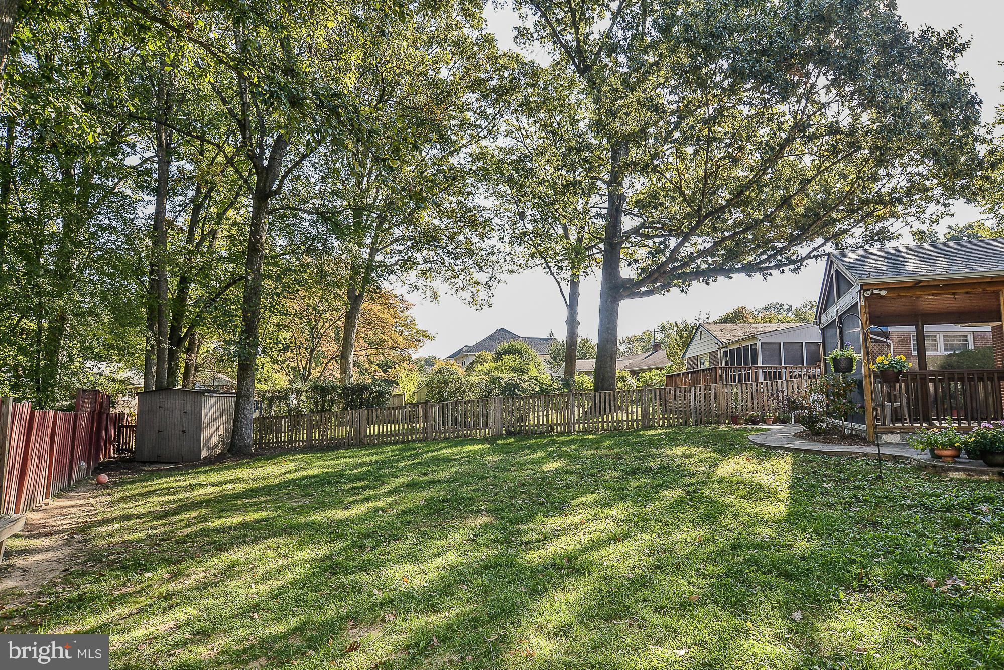 8140 Drayton Lane Springfield, VA 22151 - Photo 28 of 30 a view of a house with a big yard and large trees