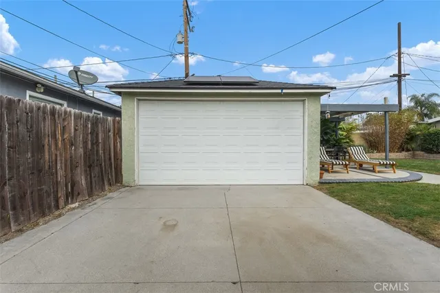 a view of a porch with a table and chairs