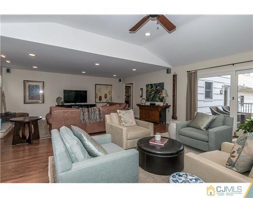 23 Tamarack Road Edison, NJ 08820 - Photo 11 of 23 a living room with furniture and a flat screen tv