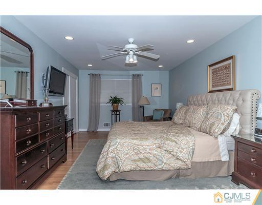 23 Tamarack Road Edison, NJ 08820 - Photo 12 of 23 a living room with furniture and a flat screen tv