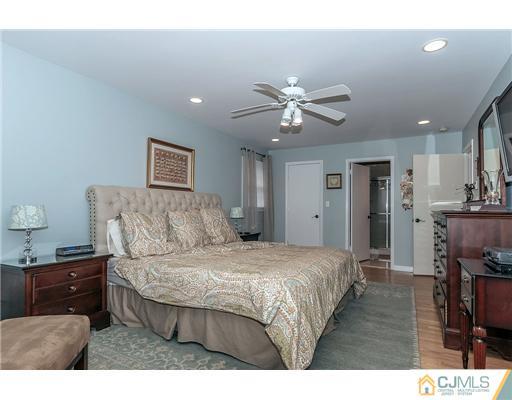23 Tamarack Road Edison, NJ 08820 - Photo 13 of 23 a living room with furniture and a chandelier