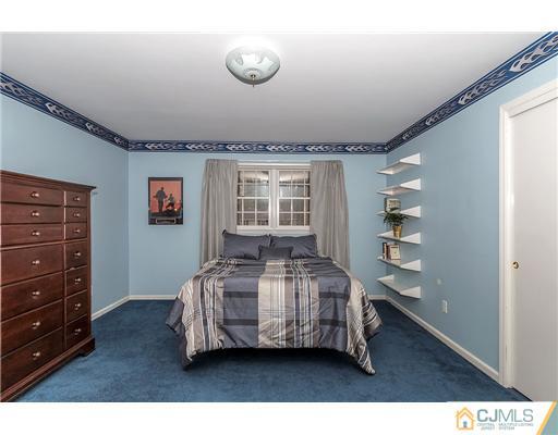 23 Tamarack Road Edison, NJ 08820 - Photo 18 of 23 a bedroom with a bed and a window