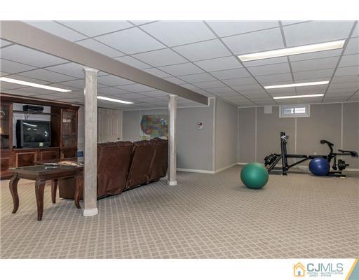 23 Tamarack Road Edison, NJ 08820 - Photo 19 of 23 a room with furniture and a wooden floor