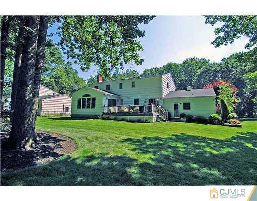 23 Tamarack Road Edison, NJ 08820 - Photo 23 of 23 a front view of a house with a yard