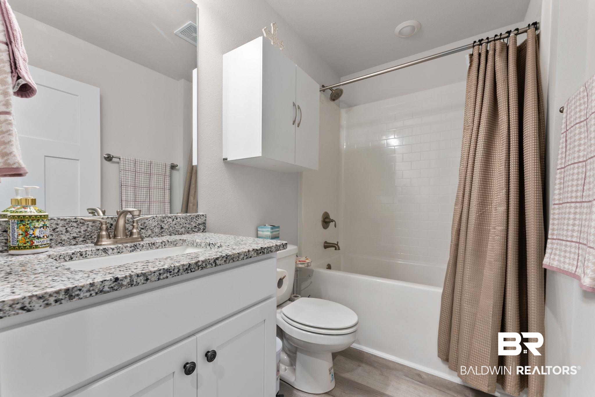 692 Mayflower Drive Foley, AL 36535 - Photo 31 of 40 Full bath featuring vanity, shower / tub combo, and light wood-style floors