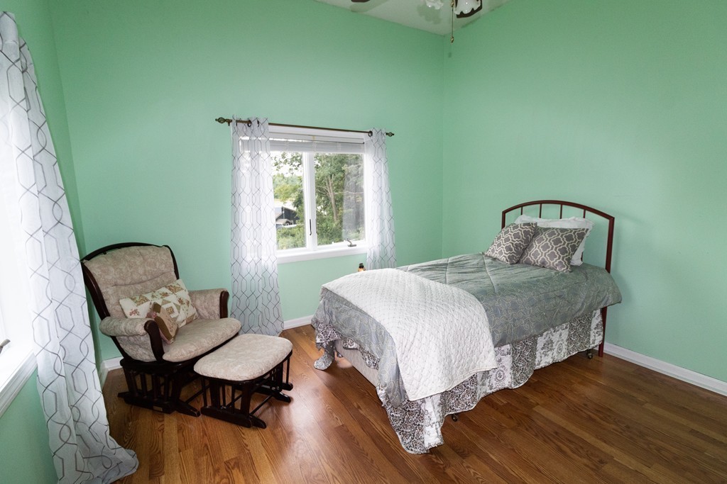 44 Flint Road Tyngsborough, MA 01879 - Photo 17 of 29 a bedroom with a bed chair and window