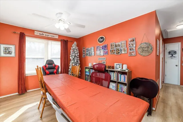 a view of a dining room with furniture and window