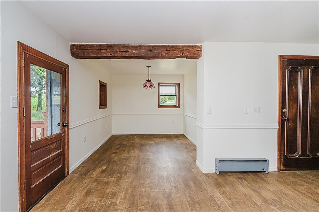 173 Anthony Road Indiana, PA 15701 - Photo 25 of 49 a view of a hallway with wooden floor and staircase