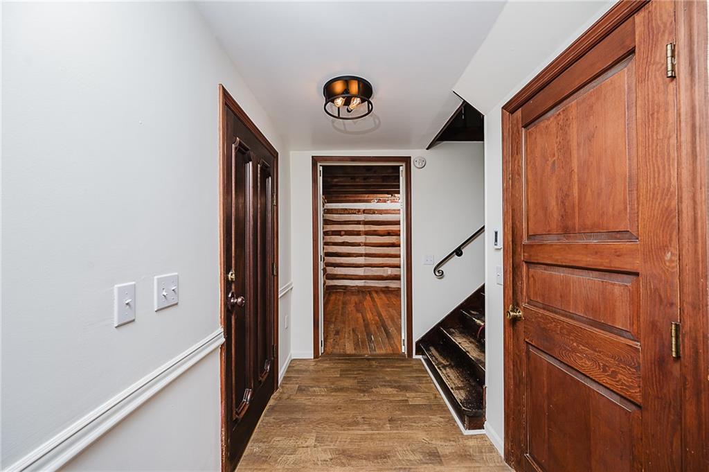 173 Anthony Road Indiana, PA 15701 - Photo 29 of 49 a hallway with front door wooden floor and stairs
