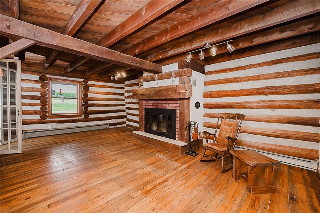 173 Anthony Road Indiana, PA 15701 - Photo 31 of 49 a view of livingroom with wooden floor and a fireplace