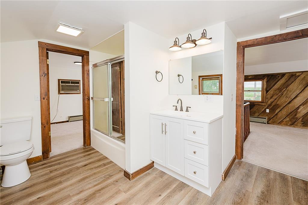 173 Anthony Road Indiana, PA 15701 - Photo 40 of 49 a spacious bathroom with a double vanity sink a mirror and a toilet