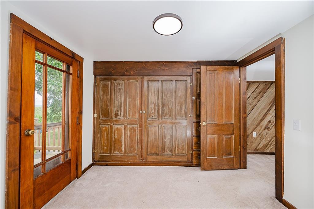 173 Anthony Road Indiana, PA 15701 - Photo 42 of 49 an empty room with wooden floor and windows
