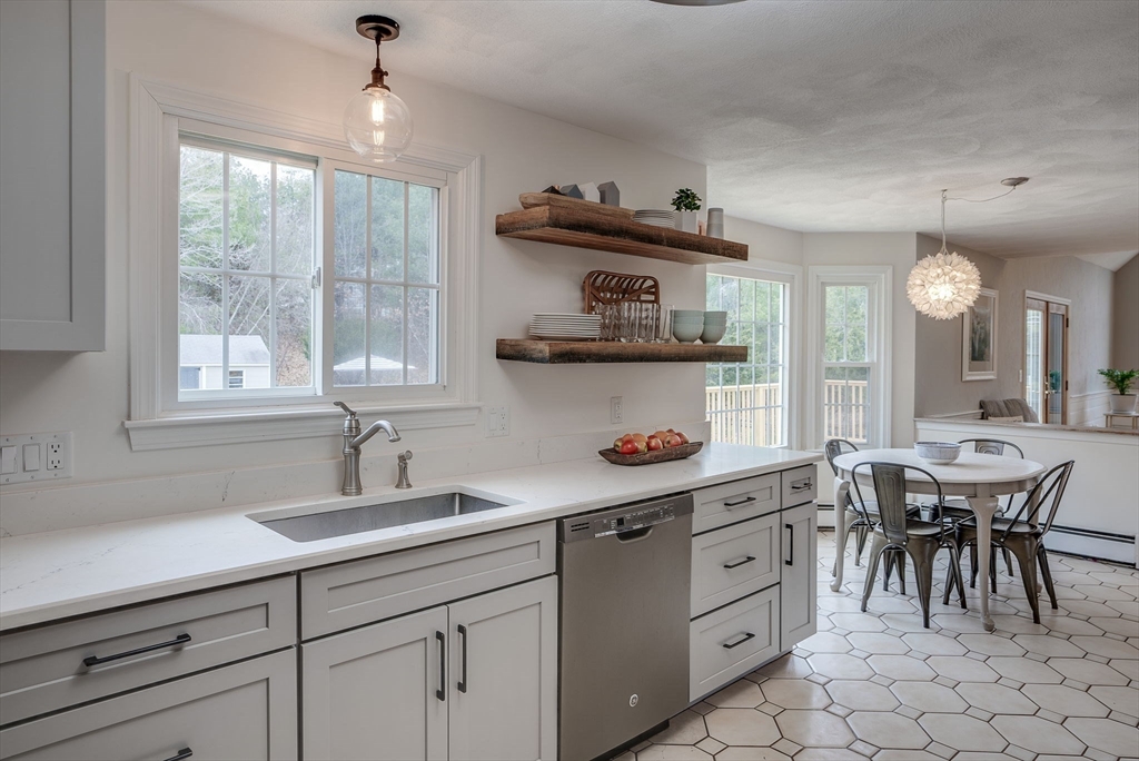 71 Houghton's Mill Road Lunenburg, MA 01462 - Photo 13 of 39 a view of a kitchen area with furniture and window