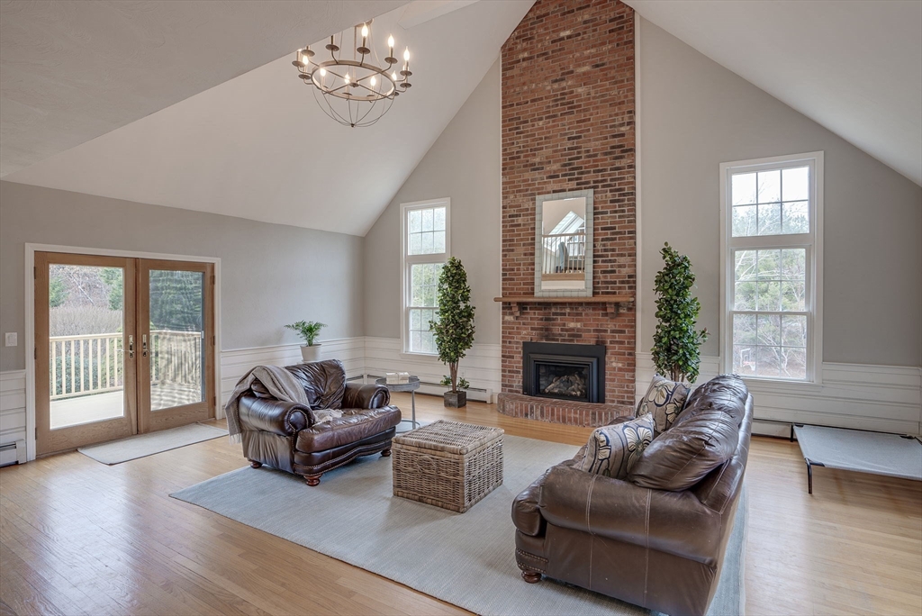 71 Houghton's Mill Road Lunenburg, MA 01462 - Photo 17 of 39 a living room with furniture a fireplace and a large window