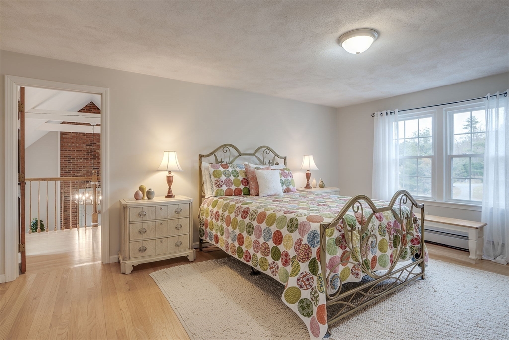 71 Houghton's Mill Road Lunenburg, MA 01462 - Photo 19 of 39 a bed sitting in a bedroom next to a window