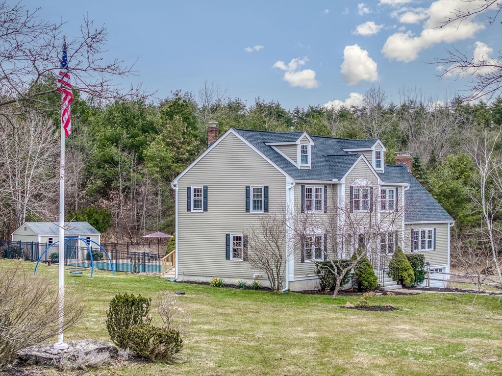 71 Houghton's Mill Road Lunenburg, MA 01462 - Photo 2 of 39 a view of a house with a big yard and potted plants in front of it