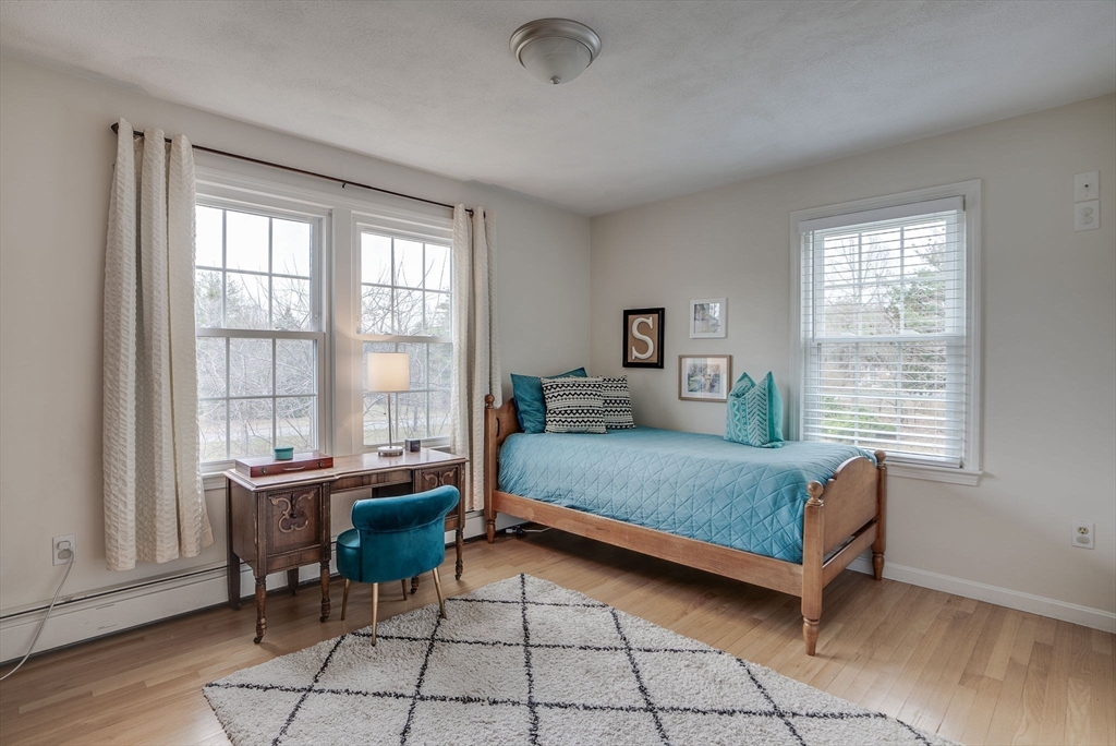 71 Houghton's Mill Road Lunenburg, MA 01462 - Photo 21 of 39 a bedroom with a bed and a table