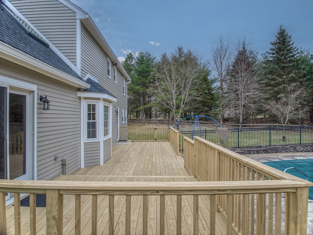 71 Houghton's Mill Road Lunenburg, MA 01462 - Photo 31 of 39 a view of a balcony with wooden floor and fence