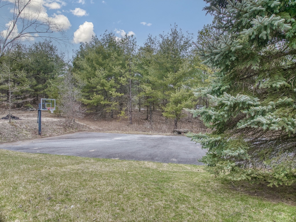 71 Houghton's Mill Road Lunenburg, MA 01462 - Photo 35 of 39 a view of a yard with a tree