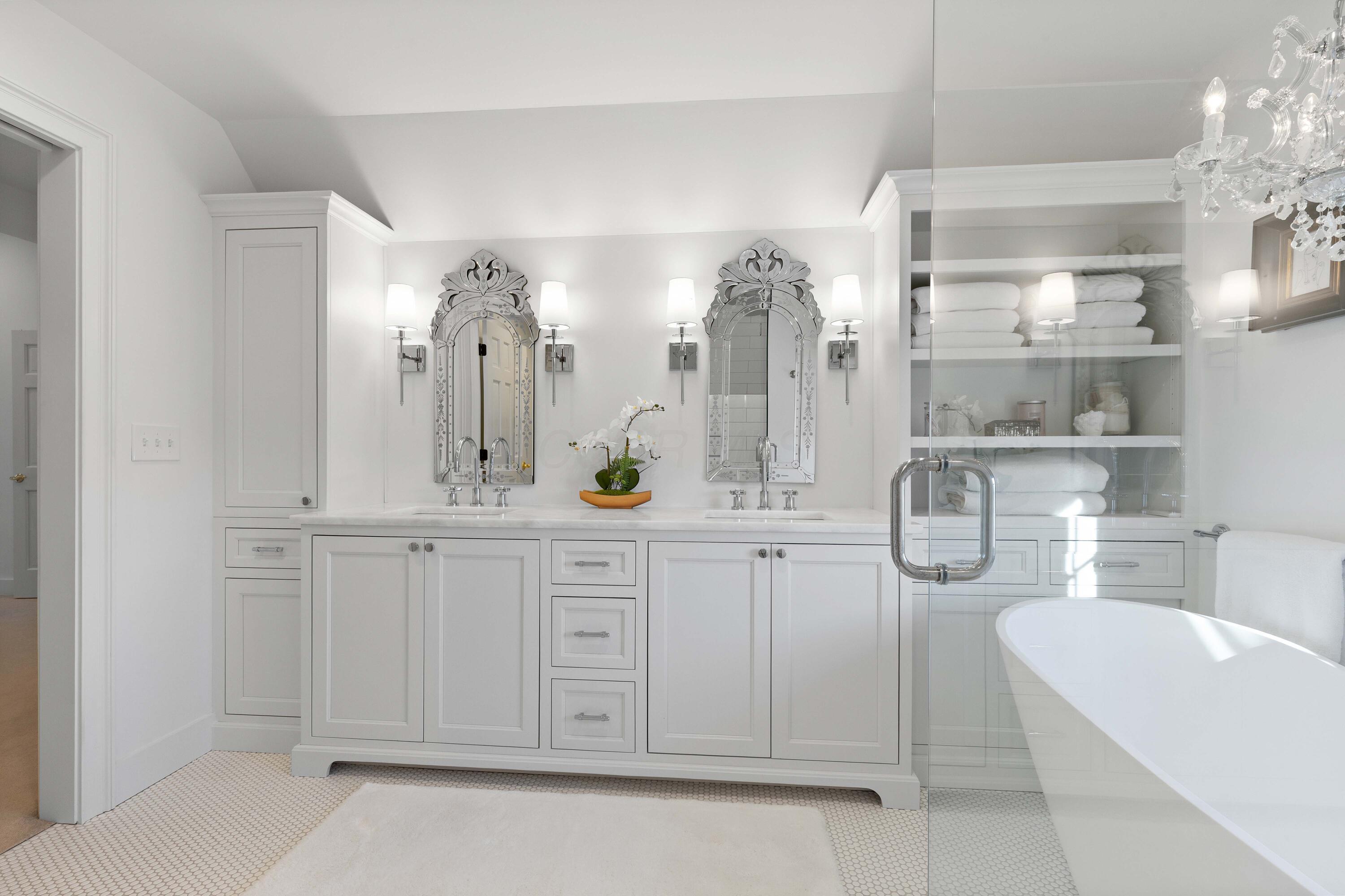 1364 Dale Ford Road Delaware, OH 43015 - Photo 53 of 112 • Ceramic tile flooring • White painted walls • Custom built enclosed vanity with double bowl, marble sinktop • Lighted wall sconces • Bubble jetted garden tub • Linen storage • Chandelier • Can lighting • (2) shower stations with rainhead & wands with ceramic tile surround • (1) extra rainhead in center with ceramic tile surround • Pocket door • Mirrors are negotiable
